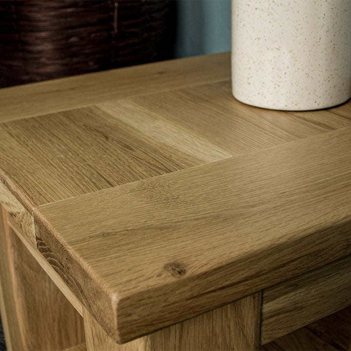 A close up of the top of the Camden Oak Lamp Table, showing the wood grain and colour.