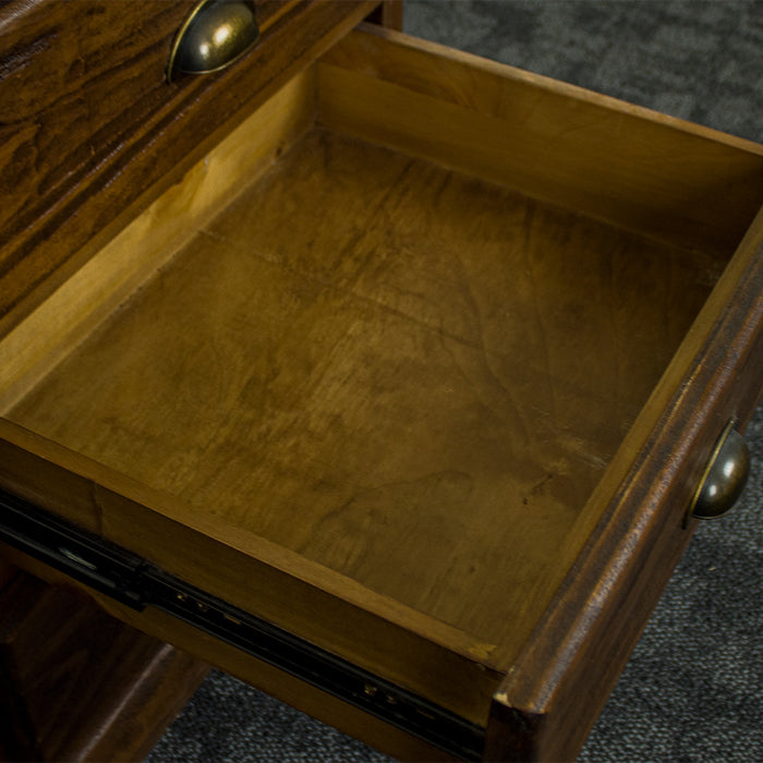 An overall view of the drawers on the Heid Large 3 Drawer Pine Bedside.