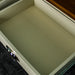 Inside the white drawer of the Alton 2 Drawer Pine Hall Table.