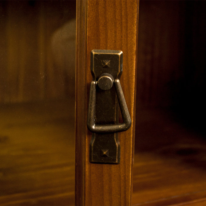 A close up of the handle on the door of the Montreal Pine Corner Entertainment Unit.
