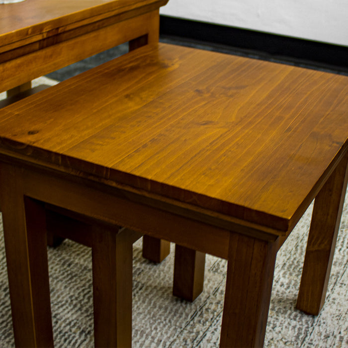 The middle of the Montreal 3 Piece Pine Nesting Tables.