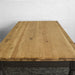 An overall top down-like view of the Boston Oak Large 2m Dining Table.