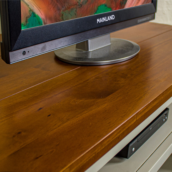 A close up of the top of the Alton Corner TV Unit, showing the rimu stain and wood grain.