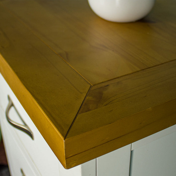 A close up of the top of the Felixstowe 5 Drawer Pine Lingerie Chest, showing the wood grain and colour.