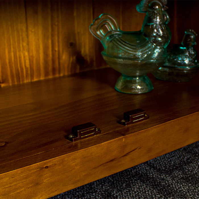 A close up of the magnetic latch on the Montreal Small Pine Buffet