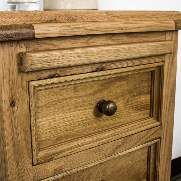 A closer view of the top shelf (closed) on the Versailles Oak Bedside Cabinet.