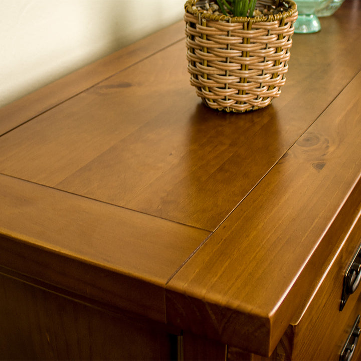 A close up of the top of the New Quebec 7 Drawer Lowboy, showing the wood grain and colour.