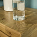 A close up of the top of the Amstel Oak Bedside Table, showing the wood grain.