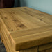 A close up of the top of the Camden Oak Blanket Box, showing the wood grain and colour.