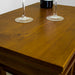 A close up of the top table, showing the wood grain and colour.