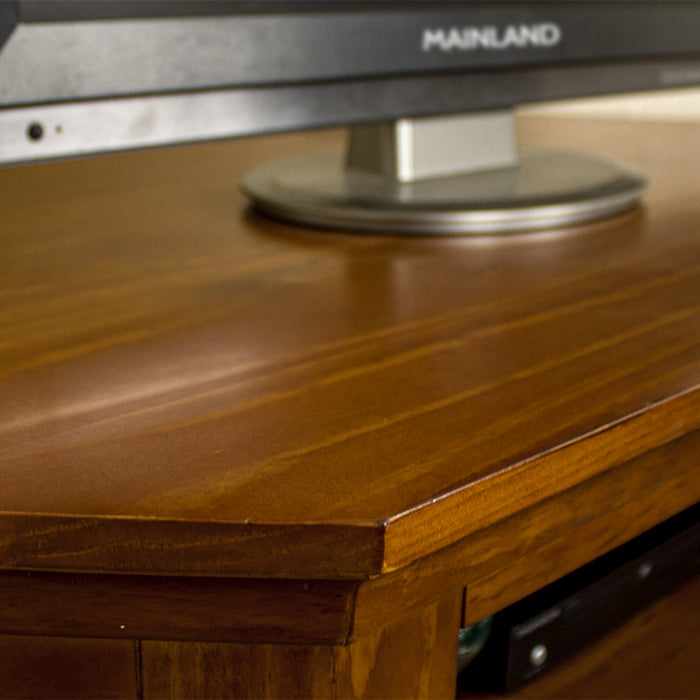 A close up of the top of the Montreal Pine Corner Entertainment Unit, showing the wood grain and colour.