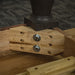 A close up of the screws that hold the legs of the Boston Oak Extending Dining Table to the body securely.