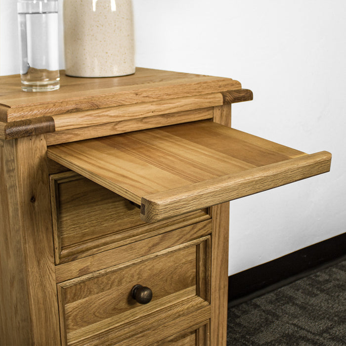 An overall view of the Versailles Oak Bedside Cabinet's top shelf above the drawers.