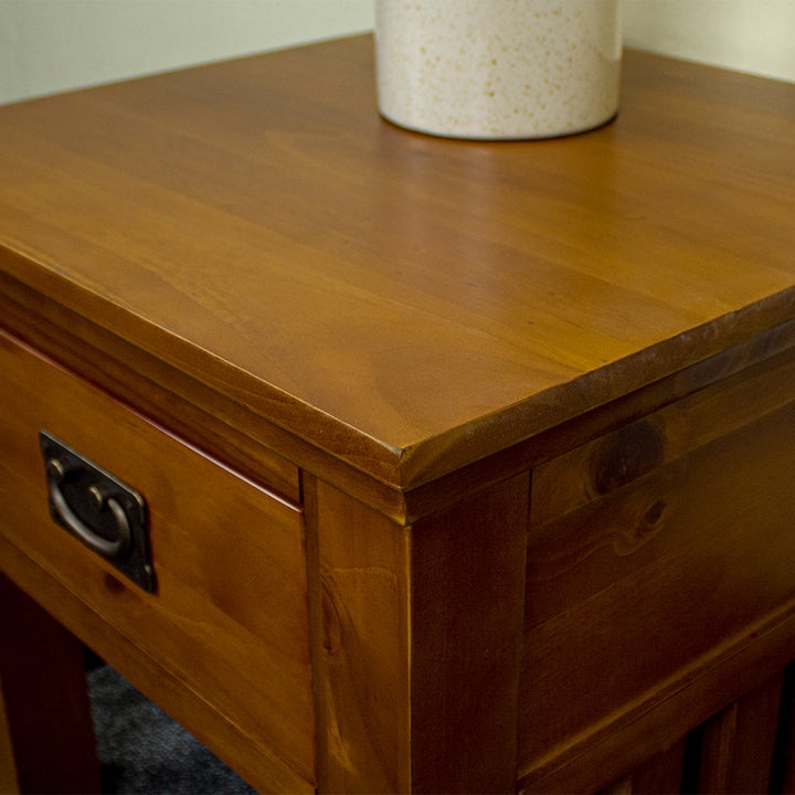 A close up of the top of the Montreal Pine Lamp Table, showing the wood grain and colour.