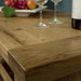 A close up of the top of the Farmhouse Coffee Table, showing the wood grain and colour.