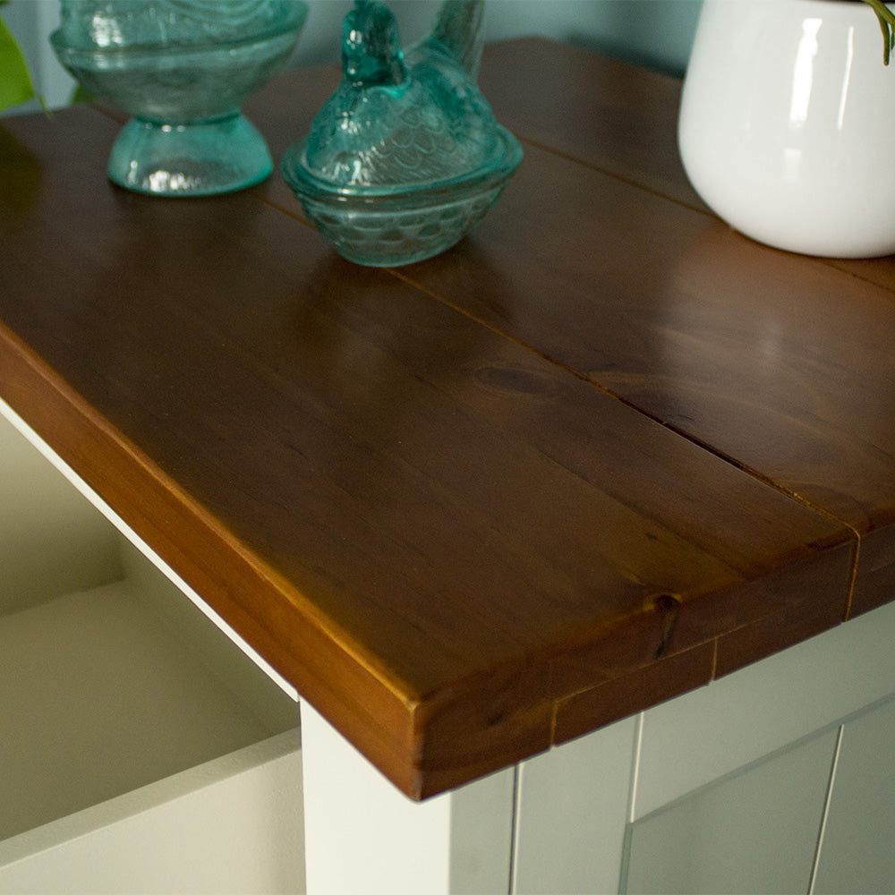 A close up of the top of the Alton 5 Drawer Lingerie Chest, showing the rimu stain and wood grain.