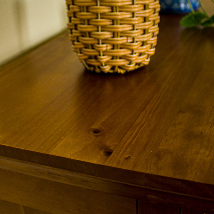 A close up of the top of the Montreal Small Pine Buffet, showing the wood grain and colour.